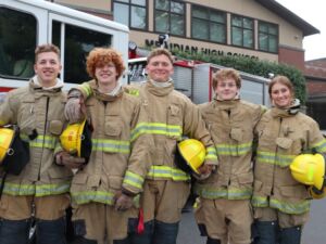Five fire science students in full gear