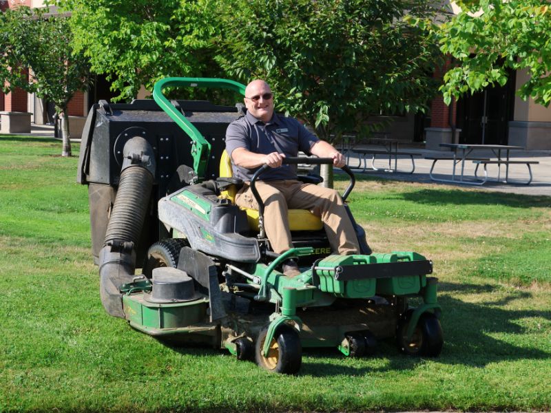 Kurt on a lawn mower